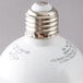 A close up of a Satco frosted LED globe light bulb.