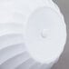 a white plastic container with a circular design