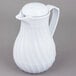 A white Vollrath SwirlServe hot and cold beverage server with a lid and handle.