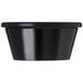 A black oval Carlisle melamine ramekin.