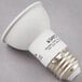 A Satco warm white LED reflector light bulb with black text on it.