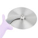 A Dexter-Russell stainless steel pizza cutter with a purple handle.