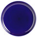 A close-up of a cobalt blue Tuxton pizza serving plate.