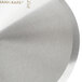 A close-up of a Dexter-Russell circular stainless steel pizza cutter blade.