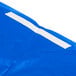 A white plastic bag with blue and white packaging tape that says "Creative Converting Stay Put Royal Blue Tablecloth"
