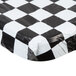 A white rectangular tablecloth with a black and white checkered pattern and elastic edges.