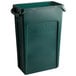 A green plastic Rubbermaid Slim Jim trash can.