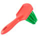 A green and orange Prince Castle Saber King cleaning brush with a green handle.