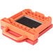 A close-up of an orange and black Prince Castle dicer blade and pusher head assembly with a grid on top.