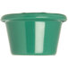 A close-up of a green Carlisle smooth melamine ramekin.