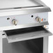 A stainless steel Cooking Performance Group gas griddle with two burners.