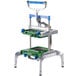 A metal machine with a green and blue handle.