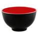 A black bowl with a red rim.