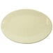An Elite Global Solutions Vanilla oval melamine plate with a plain edge on a white background.