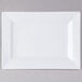 A white rectangular plate with a plain edge.