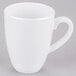 A close-up of a white Elite Global Solutions melamine mug with a handle.