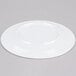 An Elite Global Solutions white melamine plate on a gray surface.