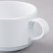 A white melamine cup with a handle.