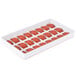 A red Martellato silicone round mold with 24 compartments.