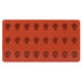 A red silicone round tray with 24 compartments.