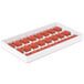 A white silicone tray with 24 red heart-shaped molds.