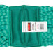 A green fabric roll with a white label.