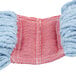 A Rubbermaid blue and red yarn mop head.
