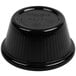 A black plastic Carlisle ramekin lid.