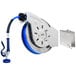 A T&S blue and silver hose reel wheel with a hose attached.