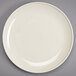 A Homer Laughlin ivory round plate with a rim.