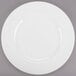 A white Libbey porcelain plate with a wide white rim.