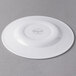 A white Libbey porcelain plate with a circular design on the rim.