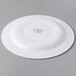 A Libbey white porcelain plate with a medium rim and a circular design on the rim.