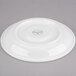 A white Libbey porcelain tea saucer with a circular rim.