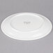 A white Libbey porcelain plate with a narrow rim on a gray background.