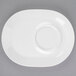 A white porcelain racetrack plate with a round center.