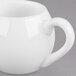 A white Libbey Royal Rideau porcelain creamer with a handle.