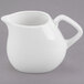 A white Libbey porcelain creamer with a handle.