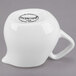 A white Libbey porcelain creamer with a handle.