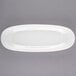 A white Libbey oval porcelain plate with a white rim.