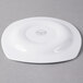 A white Libbey porcelain plate with a circular design on it.