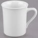 A close-up of a white Libbey porcelain mug with a handle.