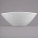 A white bowl with a small rim on a white surface