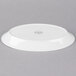 A white Libbey oval porcelain platter with a circular design on it.