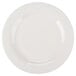 A close-up of a white Reserve by Libbey porcelain plate with a curved white rim.