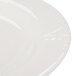 A close-up of a white Reserve by Libbey Royal Rideau porcelain plate with a medium rim.