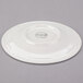 A white Royal Rideau porcelain tea saucer with a circular design on the edge.