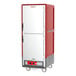 A red and grey Metro C5 3 Series heated holding cabinet with wheels.