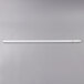 A Satco T8 fluorescent tube with white ends on a gray background.