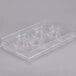 A clear plastic Martellato chocolate mold with 7 espresso cup compartments.